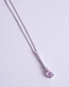A pink sapphire and diamond set 9ct white gold pendant on a fine chain.