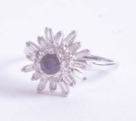 A platinum diamond and sapphire ring set with baguette and round cut diamonds, size U,