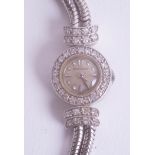 Jaeger le Coultre, a ladies 18ct white gold and diamond set cocktail watch with guarantee dated