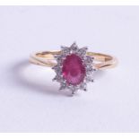 An 18ct ruby and diamond set cluster ring size O/P.