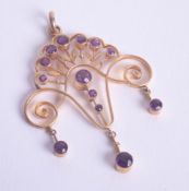 A pretty Edwardian amethyst and gold set pendant.