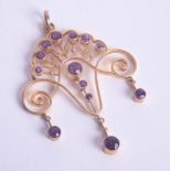 A pretty Edwardian amethyst and gold set pendant.