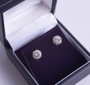 A fine pair of 18ct diamond ear studs, approx. 2.10ct.