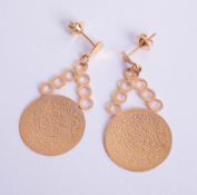 A pair of high carat gold eastern coin pendant earrings, approximately 5.30g.