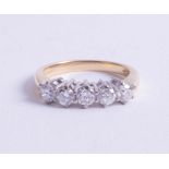 An 18ct diamond set five stone ring, size N.