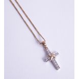 A diamond set cross in white metal on a fine 9ct chain, 4.00g.