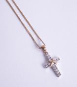 A diamond set cross in white metal on a fine 9ct chain, 4.00g.