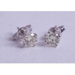 A pair of 18ct white gold diamond stud earrings, approx. 0.70ct.