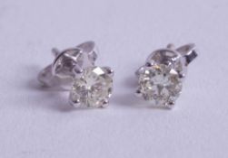 A pair of 18ct white gold diamond stud earrings, approx. 0.70ct.