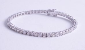 A fine 18ct and diamond set line bracelet approx. 7ct, length 18.50cm