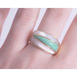 An 18ct mother of pearl and green domed ring, size Q, approx 10.60g.