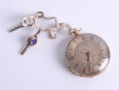 An antique 18ct gold open face fob watch, with decorative and enamelled back plate (worn) and two