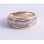 An 18ct diamond set band ring, size N.