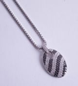 An 18ct black and white diamond set pendant and chain.