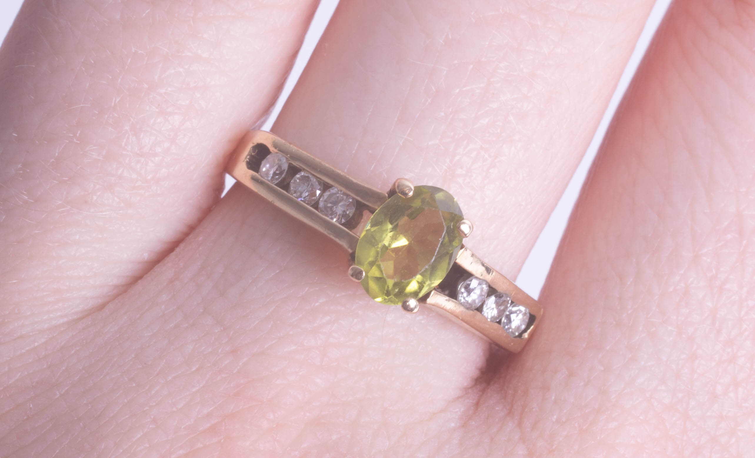 A 9ct peridot and diamond set ring, size Q.