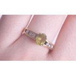 A 9ct peridot and diamond set ring, size Q.