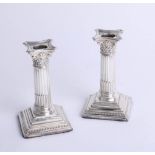 A pair of short silver desk candlesticks, maker 'WI & S'. Sheffield, height 12cm.