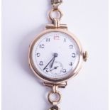 A vintage 9ct midsize (ladies) wristwatch, with arabic numerals and red 12, overall 29.7g.