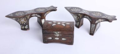 A pair of unusual wood and mother of pearl inlaid stands, length 23cm, height 8cm and a similar