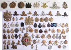 A collection of approx. 90 military cap badges displayed on two sheets including Royal Engineers,