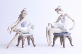 Lladro, a pair of seated ballerinas.
