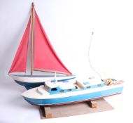 Enya, model cabin cruiser boat with engine, together with a pond yacht (2).