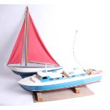 Enya, model cabin cruiser boat with engine, together with a pond yacht (2).