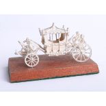 A modern silver model of a coronation coach, boxed, Toye, Kenning and Spencer Ltd.