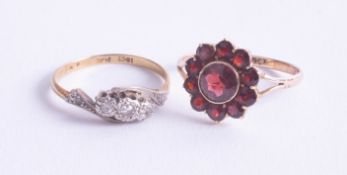 A 9ct garnet cluster ring, 2.2g, size P, together with an 18ct small diamond set ring, 2.1g, size