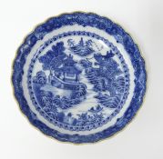 A Chinese Qianlong cobalt blue and white scallop shaped porcelain dish, diameter 12cm, with