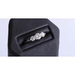 An 18ct white gold trilogy diamond ring, approx 1.00ct, size M.