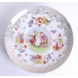 A Vienna style porcelain plate signed 'Kaufmann', diameter 35cm.