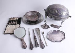 A collection of various silver plated wares, including domed food warmer, silver ring stand, part