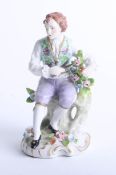 A 19th century Sitzendorf porcelain figure modelled as a Gardner, under Alfred Voigt, under glaze