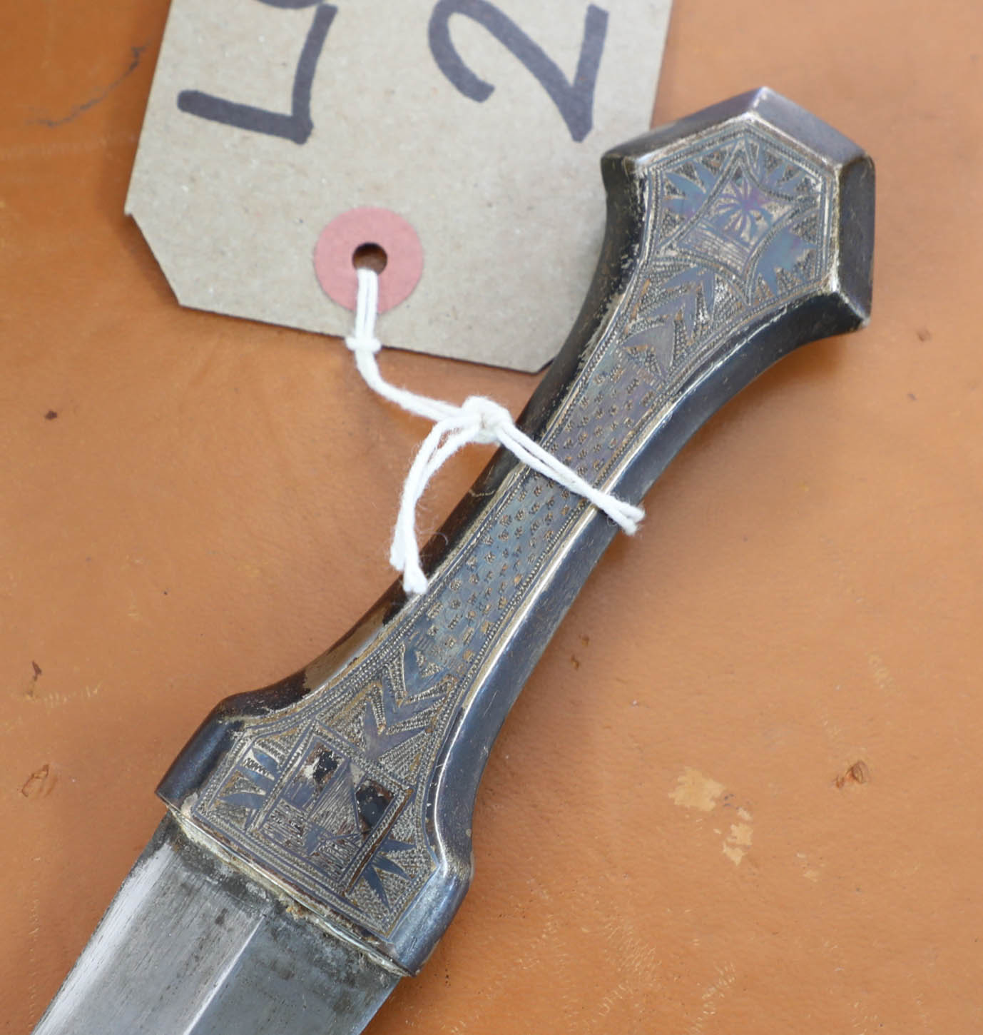 A dagger in white metal casing, marked 'Mosul 1942'. - Image 3 of 9