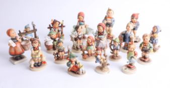 A collection of 18 various Hummell figures.