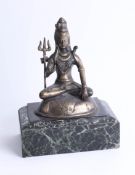 A brass eastern Buddha on marbleised base, height 30cm.