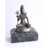 A brass eastern Buddha on marbleised base, height 30cm.