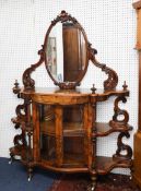 A Victorian figured walnut and mirror-back credenza, width approximately 141cm.