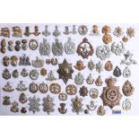 A collection of approx. 72 military cap badges, including Royal Irish, Royal Scots and Royal Welsh