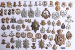 A collection of approx. 72 military cap badges, including Royal Irish, Royal Scots and Royal Welsh