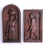 A pair of unusual carved wood figurative panels, the tallest height 43cm.