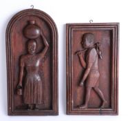 A pair of unusual carved wood figurative panels, the tallest height 43cm.