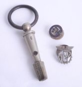 A rare railway key whistle marked 'December 15th 1868', together with a TGW badge.