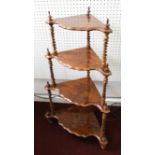 A Victorian four tier figured walnut corner whatnot.