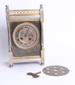 French brass case mantle clock, eight day movement, gong strike with key, height 28cm.