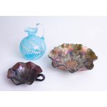 A Victorian blue glass and enamel jug, two purple carnival glass dishes.