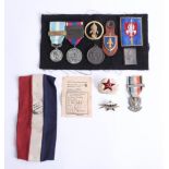 A collection of various loose badges and some French medals including Cameroon legion medal etc.