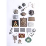 A collection of various military and other badges, buckles and interesting objects. Part of the Late