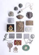 A collection of various military and other badges, buckles and interesting objects. Part of the Late